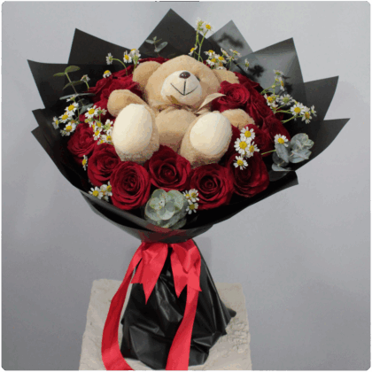 Bouquet de  rosas rojas Santa María follaje más un peluche