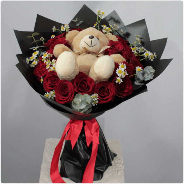 Bouquet de  rosas rojas Santa María follaje más un peluche